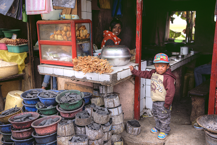 Boy with charcoal seller